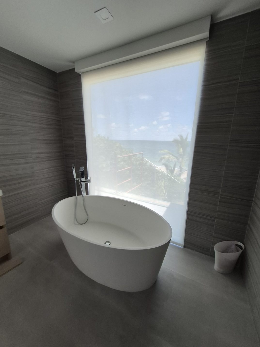 Roller shade above a bathtub in a Miami residence