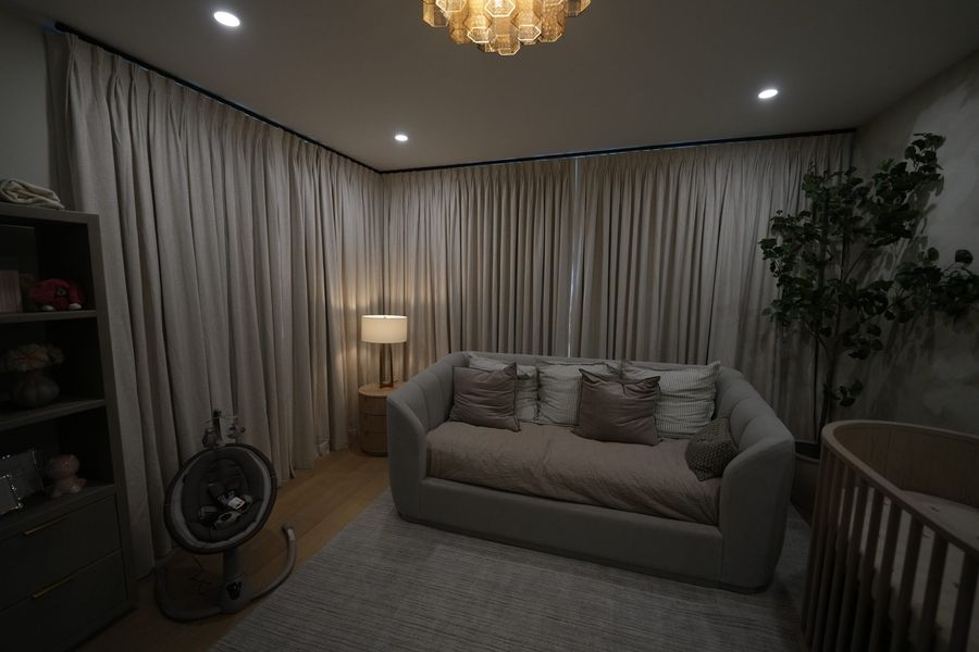 Floor-to-ceiling ripplefold draperies in a Fort Lauderdale family room