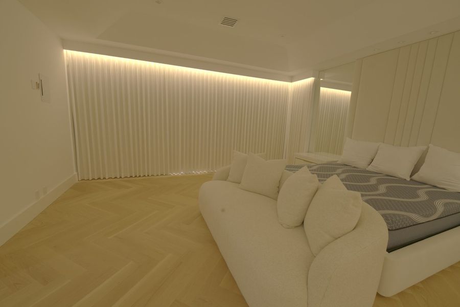 Kravet Smart ripplefold drapery closed under a custom wood valance in a Boca Raton master bedroom