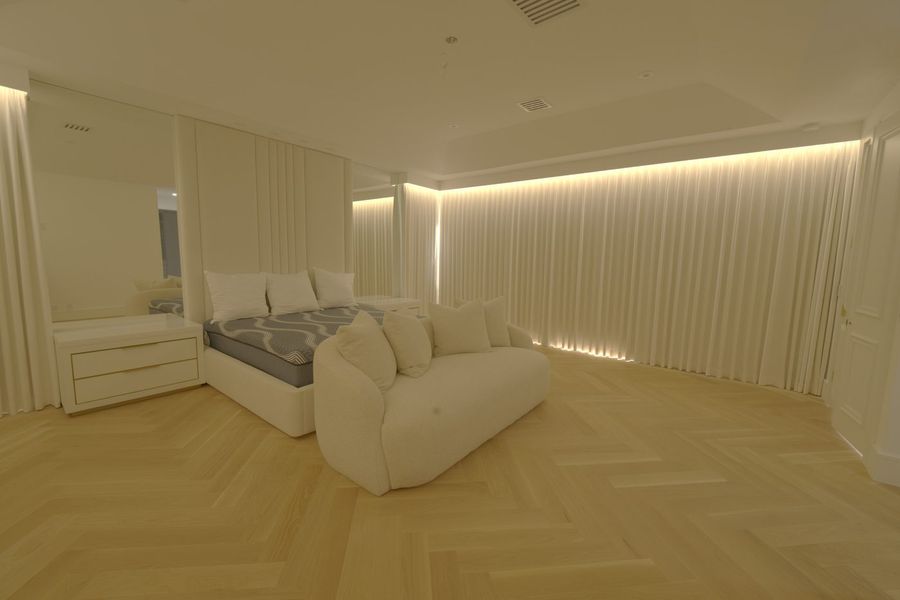 Boca Raton master bedroom at night with the ripplefold drapery closed all the way around under the custom valance