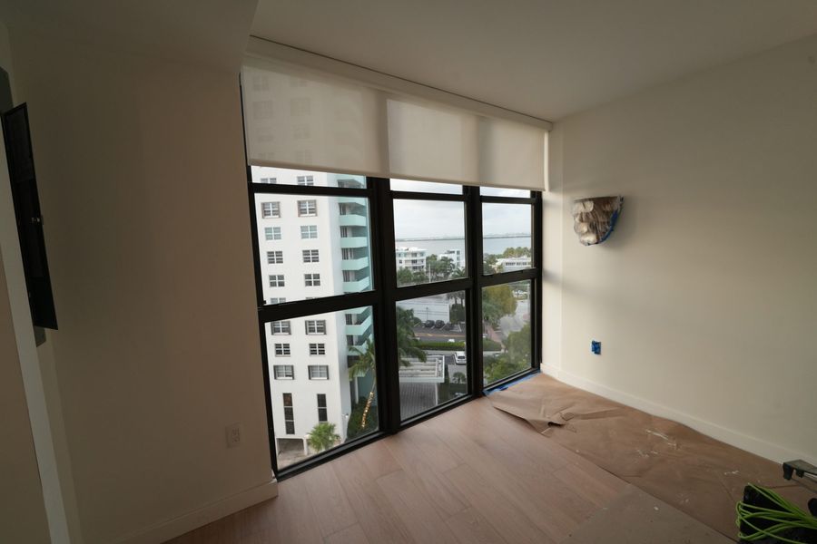 Roller shade on a corner window in a South Beach condo, Miami Beach