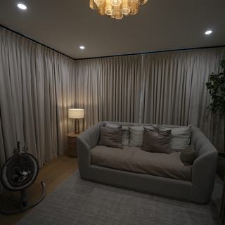 Floor-to-ceiling ripplefold draperies in a Fort Lauderdale family room
