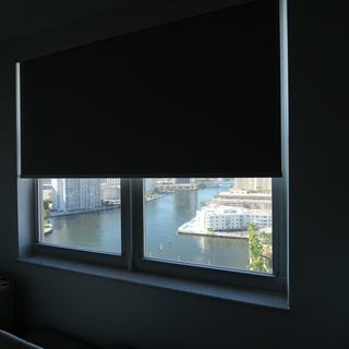 Blackout roller shade on a bedroom window facing the marina, Hallandale Beach