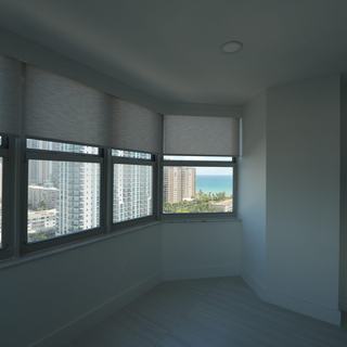 Roller shades on city-facing windows of a Hallandale Beach condo