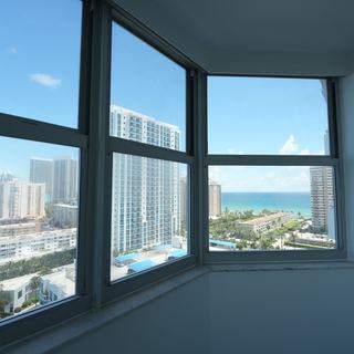 Corner windows with Elba Daylight roller shades raised, Intracoastal view, Hallandale Beach