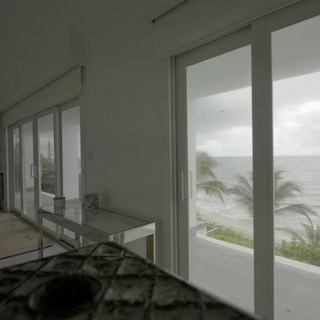 Motorized solar shades on the kitchen and dining ocean wall, Hillsboro Beach