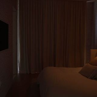 Bedroom with motorized blackout draperies fully closed, Ritz-Carlton Residences Miami Beach