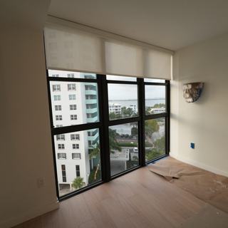 Roller shade on a corner window in a South Beach condo, Miami Beach