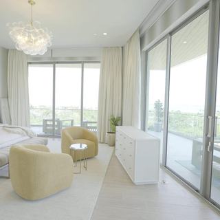 Drapery traveled open to the terrace light on Crestron QMT tracks, St. Regis Longboat Key