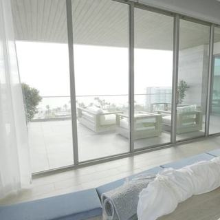 Sheer draperies drifting across the bay wall at the St. Regis Longboat Key, Sarasota