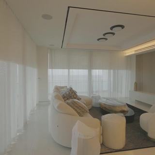 Loro Piana Interiors Limoges White ripplefold sheers across the great room glass at the Ritz-Carlton Residences Sunny Isles Beach