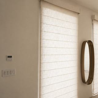 Custom roman shades on the Lutron roman-shade kit in a Turks and Caicos villa