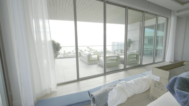 Sheer draperies drifting across the bay wall at the St. Regis Longboat Key, Sarasota