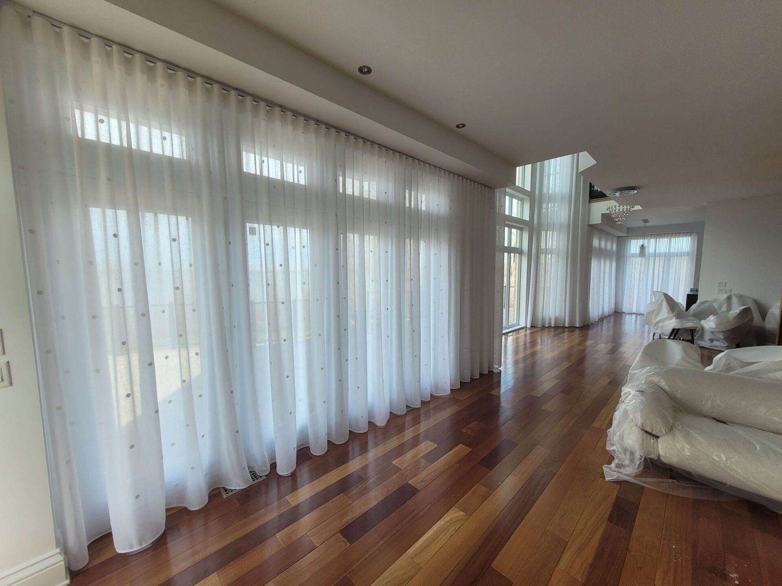 Custom sheers and draperies installed in a South Florida living room