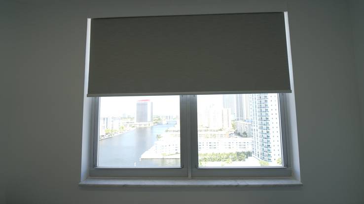 Bedroom window with the Elba Twilight blackout roller halfway down