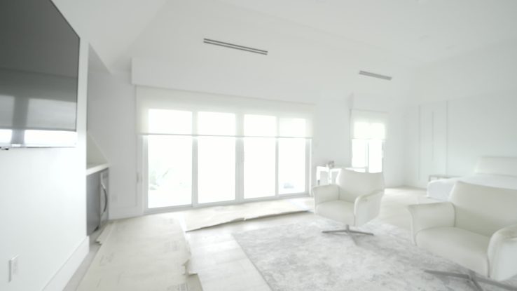 Primary bedroom with dual solar and Luna White blackout shades