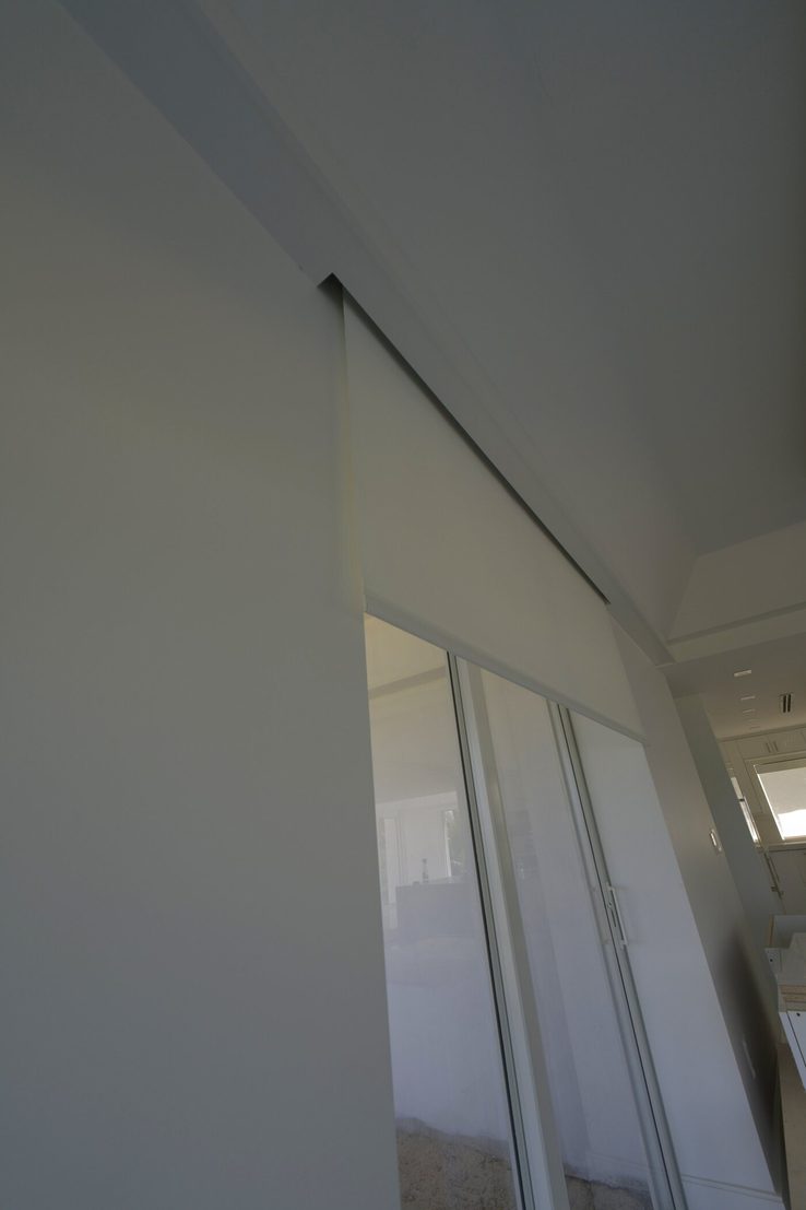 Shade edge detail following the raked gable ceiling line