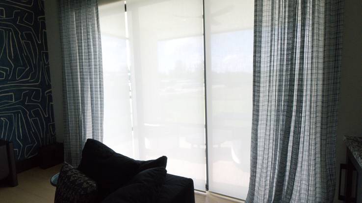 Office with the Paris 3% solar screen lowered behind the Kravet Design performance drapery