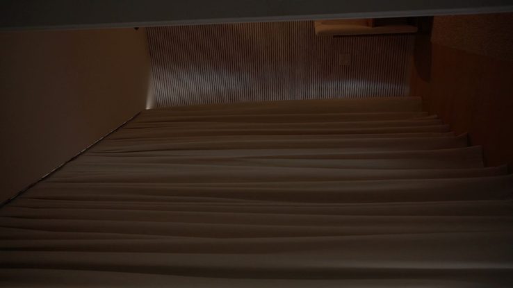 Close view of ripplefold drapery folds showing consistent wave spacing