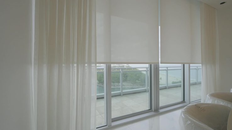 T-Screen 3% solar shade layered behind sheer draperies on one wall at the Ritz-Carlton Residences, Sunny Isles Beach