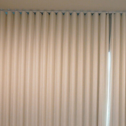 Villa Nova Toronto FR Chalk blackout drapery installed on the bent track in the master bedroom