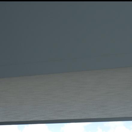 The custom lacquered basswood valance with the Elba fabric dropping beneath it