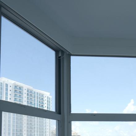 The angled corner where two windows meet under the valance