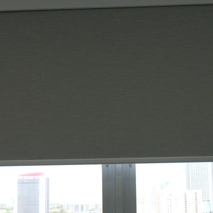 Elba Twilight Limestone blackout roller halfway down over the bedroom window