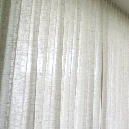 Kravet Couture Adagio wool-blend drapery installed on the primary bedroom's powered ripplefold track